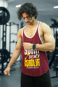 Man wearing a maroon tank top with text, flexing his arm on a white background
